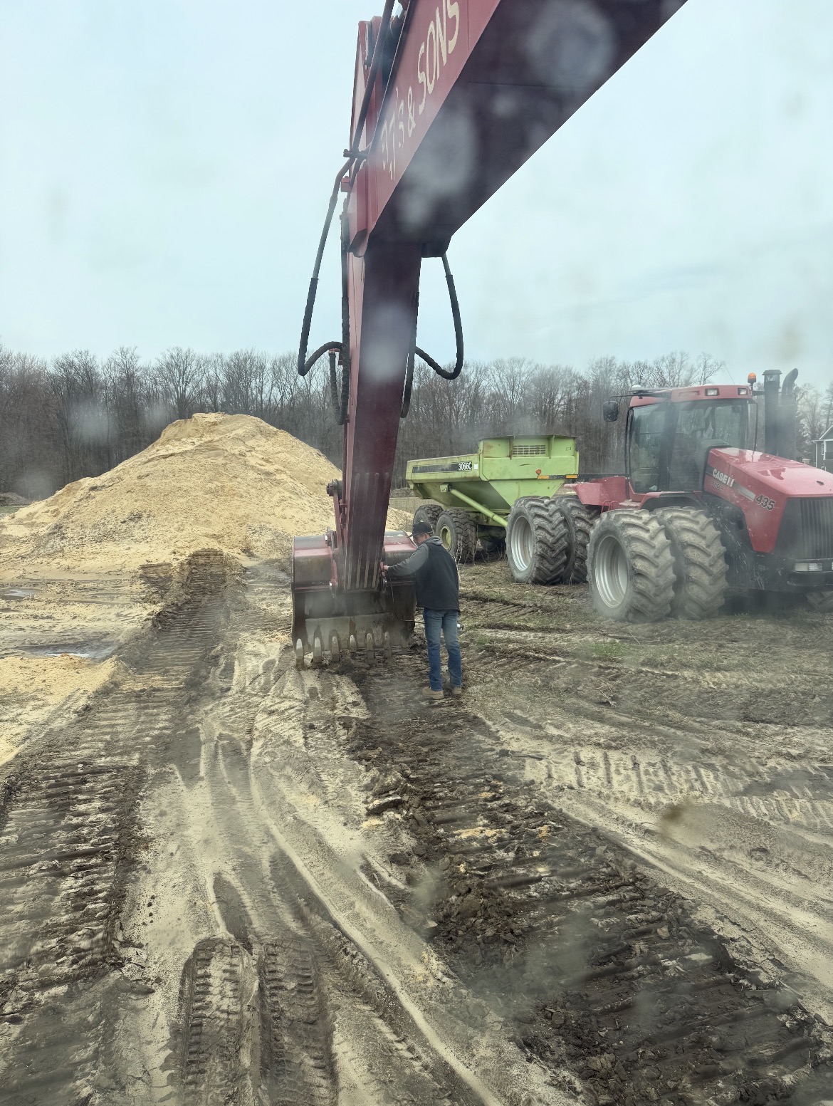 Excavator loading a dump wagon on a site