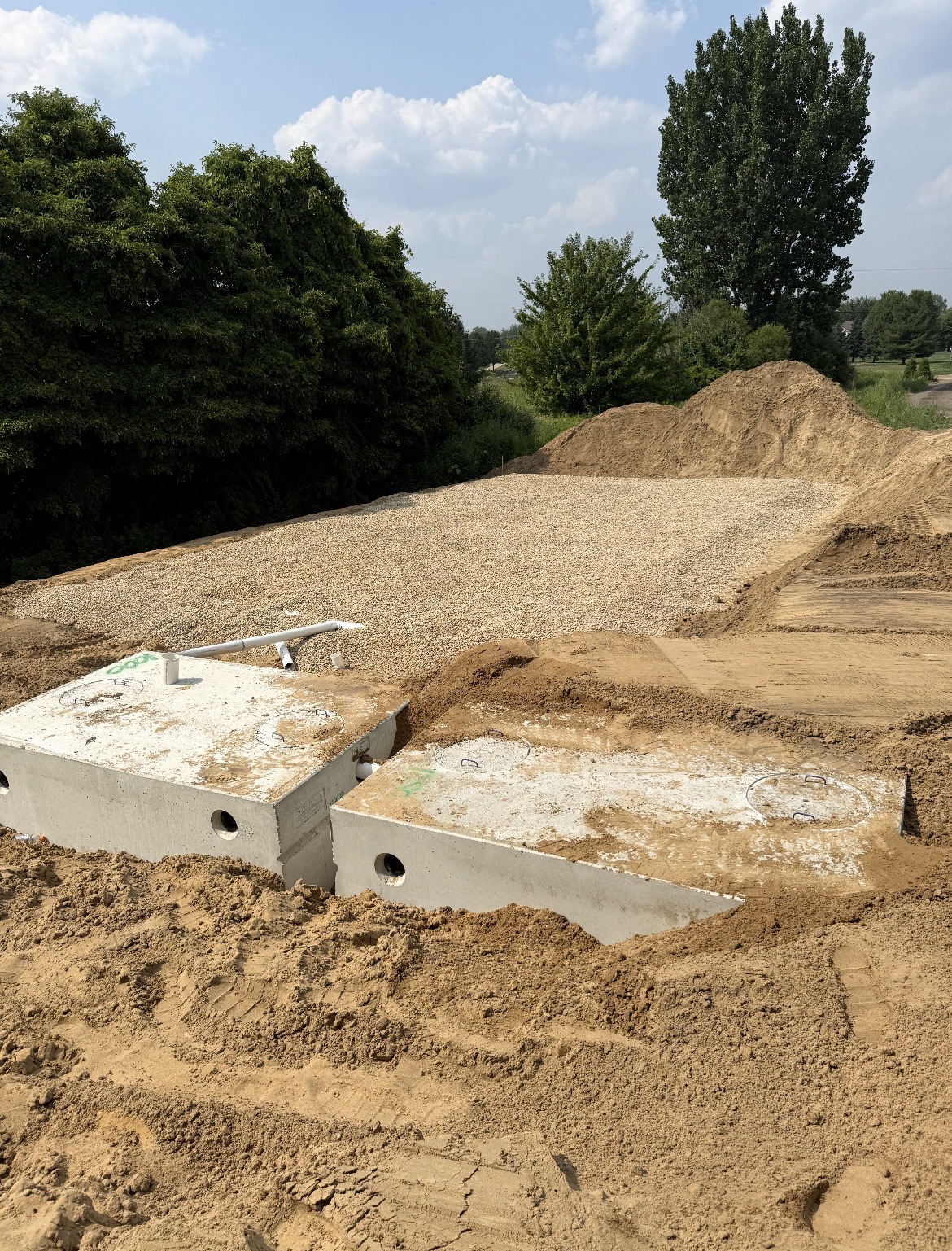 New septic tanks set with drain field stone