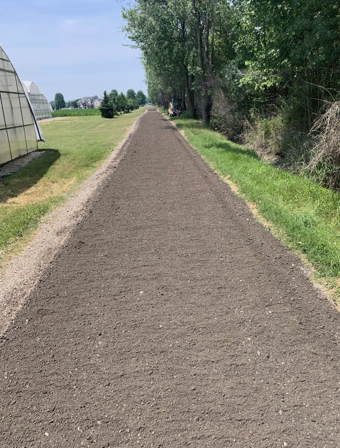 Freshly graded gravel farm lane